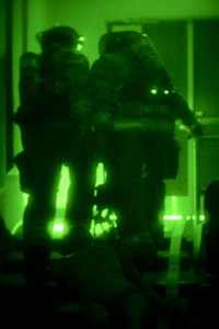 U.S. Air Force firefighters with the 169th Civil Engineer Squadron at McEntire Joint National Guard Base, S.C., conduct a nighttime structural fire exercise at the Joint Armed Forces Reserve Center, Feb. 5, 2014.