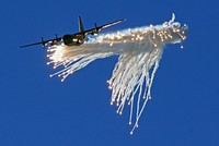 Lockheed C-130 Hercules Dropping flares.Warbirds show.