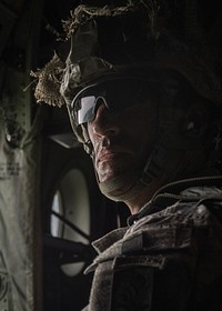 A U.S. Army paratrooper waits inside an Air Force C-130J Super Hercules aircraft assigned to the 37th Airlift Squadron alongside U.S. Army and Lithuanian paratroopers over Lithuania May 17, 2014.