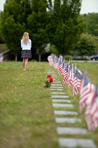 American flags mark the graves of fallen Sailors, Soldiers, Marines and Airmen at the Rhode Island Veterans Memorial Cemetery in Exeter, Rhode Island on Memorial Day, May 26, 2014.