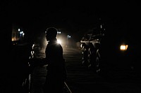 An Ethiopian soldier, as part of the African Union Mission in Somalia, walks through Baidoa, Somalia, on June 22 during a night patrol in the city. AMISOM Photo / Tobin Jones. Original public domain image from Flickr