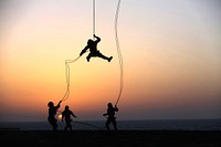 Just Hanging Out. A Marine with Battalion Landing Team 1st Battalion, 6th Marine Regiment, 22nd Marine Expeditionary Unit (MEU), rappel out of a CH-53E Super Stallion helicopter during a fast rope and rappel training exercise aboard the USS Bataan (LHD 5), at sea.