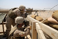 U.S. Marines with Scout Sniper Platoon, 1st Battalion, 7th Marine Regiment man security positions during a mission in Helmand province, Afghanistan, June 23, 2014.