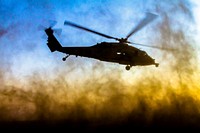 A U.S. Navy MH-60S Seahawk helicopter assigned to the aircraft carrier USS George H.W. Bush (CVN 77) takes off after a joint fire exercise near Camp Buehring, Kuwait, July 8, 2014.