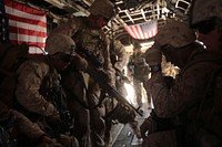 U.S. Marines with Bravo Company, 1st Battalion, 7th Marine Regiment board a CH-53E Super Stallion helicopter during a mission July 5, 2014, in Gereshk, Helmand province, Afghanistan.