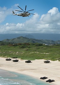 A U.S. Marine Corps CH-53E Super Stallion helicopter flies over a simulated amphibious beach assault during Rim of the Pacific (RIMPAC) 2014 at Marine Corps Base Hawaii July 29, 2014.