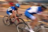 U.S. Air Force Capt. Mitchell Kieffer and Senior Master Sgt. Jason Hoover compete in the men's open cycling event during the 2014 Warrior Games at Fort Carson, Colo., Sept. 29, 2014.