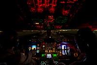 U.S. Air Force Maj. Gena Fedoruk, left, and 1st Lt. Marcel Trott, both KC-135 Stratotanker aircraft pilots with the 340th Expeditionary Air Refueling Squadron, take off from a base in the U.S. Central Command area of responsibility Sept. 23, 2014.