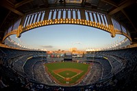 A view of Yankee Stadium in Bronx, N.Y. at sunset prior to the start of a game. The Yankees hosted Airmen for the singing of the National Anthem, Color Guard presentation, and F-16C Fighting Falcon flyover in honor of the U.S. Air Force 67th birthday. Original public domain image from Flickr