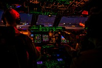 U.S. Air Force Capts. Matthew Upchurch, left, and Jennifer Nolta, both C-5M Super Galaxy pilots with the 9th Airlift Squadron, take off from Camp Bastion, Afghanistan, Oct. 6, 2014