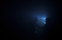 U.S. Air Force active duty and Air National Guard firefighters find their way through a simulated building fire during a Silver Flag exercise at Ramstein Air Base, Germany on Feb 28, 2015.