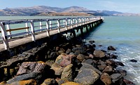 Rapaki Jetty.If you drive over the Port Hills down into Governor&rsquo;s Bay and then drive towards Lyttelton, you will come across the small settlement of Rapaki which has a Marae, a small church, a very nice bay, and the jetty. It&rsquo;s a very pleasant spot. Original public domain image from Flickr