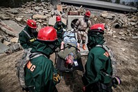 U.S. Army National Guard Soldiers provide medical aid to a simulated victim of an accident during a full scale exercise involving over 600 Army and Air National Guardsmen from New York, New Jersey, and West Virginia at Joint Base McGuire-Dix-Lakehurst, N.J., April 17, 2015. (U.S. Air National Guard photo by Tech. Sgt. Matt Hecht/Released). Original public domain image from Flickr