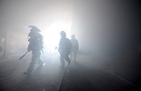 U.S. Air Force active duty and Air National Guard firefighters find their way through a simulated building fire during a Silver Flag exercise at Ramstein Air Base, Germany on Feb 28, 2015.