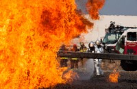 U.S. Air Force firefighters put out flames during a controlled aircraft fire exercise at Ramstein Air Base, Germany on Mar. 19, 2015.