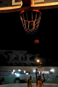 A Horseed basketball player tries to score a basket during their game against Heegan in Abdiaziz district of Mogadishu, Somalia, on March 13 2015.