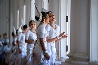 Two Women in Traditional Kandyan Dress Laugh While Waiting as Secretary Kerry Meets With Sri Lankan Foreign Minister Samaraweera