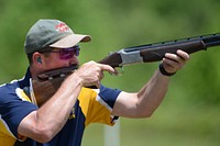 Navy Lt. Cmdr. Shawn Pyle, a member of the Navy Skeet Team, shoots during the 2015 Armed Services Skeet Championships. The five-day competition was held 11-15 May 2015 near the City of Richmond at Conservation Park of Virginia, Charles City, Virginia, May 14th 2015. Original public domain image from Flickr