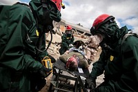 U.S. Army National Guard Soldiers provide medical aid to a simulated victim of an accident during a full scale exercise involving over 600 Army and Air National Guardsmen from New York, New Jersey, and West Virginia at Joint Base McGuire-Dix-Lakehurst, N.J., April 17, 2015.