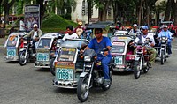 Tricycle taxis Laoag City.