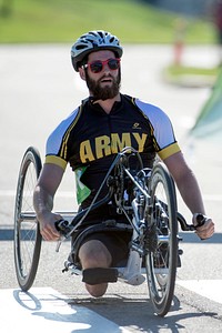 Army’s Stefan LeRoy crosses the finish line to win gold in the Men’s H2 Hand Cycle Division Division during the 2015 Department of Defense Warrior Games at Marine Corps Base Quantico June 21, 2015. Original public domain image from Flickr