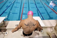 Veteran Marine Lance Cpl. Kyle Reid readies himself to swim during the 2015 Department of Defense Warrior Games in Manassas, Va. June 27, 2015.
