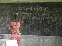 African teacher educating about AIDS. Free public domain CC0 photo.