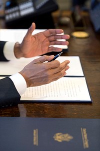 President Barack Obama gestures prior to signing a Memorandum of Disapproval regarding S.J. Res. 8&ndash;a Joint Resolution providing for congressional disapproval of the rule submitted by the National Labor Relations Board relating to representation case procedures&ndash;in the Oval Office, March 31, 2015.