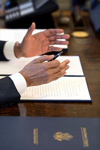 President Barack Obama gestures prior to signing a Memorandum of Disapproval regarding S.J. Res. 8–a Joint Resolution providing for congressional disapproval of the rule submitted by the National Labor Relations Board relating to representation case procedures–in the Oval Office, March 31, 2015.