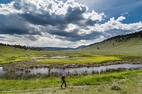 Hiking on the Blacktail Deer Plateau, Yellowstone national park, USA. NPS photo by Neal Herbert. Original public domain image from Flickr