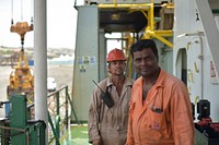 Crew pose for a photograph on board of a container ship in Mogadishu's port in Somalia on September 17, 2015.