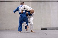 Navy Petty Officer 2nd Class Bobby Yamashita, left, and Navy Petty Officer 1st Class Robert Turquest spar during U.S. Armed Forces Judo Team practice at Fort Indiantown Gap, Pa. Sept. 21, 2015.