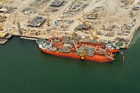 Double Banked Marine Containment Vessels. These two marine containment vessels are part of the Marine Well Containment Company's (MWCC) incident response asset collection in the U.S. Gulf of Mexico. Photo courtesy of MWCC. Original public domain image from Flickr