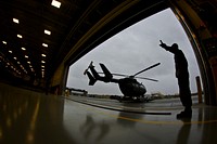 A U.S. Army Soldier with the New Jersey Army National Guard marshalls a UH-72 Lakota helicopter into the Army Aviation Support Facility at Joint Base McGuire-Dix-Lakehurst, N.J., Oct. 28, 2015.