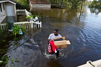 Former NFL player Robert Geathers retrieves any possessions not destroyed by the flood at his family home in Brown's Ferry near Georgetown, South Carolina, Oct. 10, 2015.