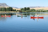 People in canoes on lake or large river. Original public domain image from Flickr