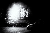 Church through wet car window at night, monotone. Original public domain image from Flickr