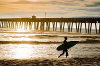 Surfer at beach. Free public domain CC0 photo.