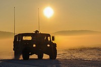 A U.S. Army Humvee is maneuvered through the 7th Army Joint Multinational Training Command's Hohenfels Training Area, Germany, Jan. 21, 2016. (U.S. Army photo by Markus Rauchenberger). Original public domain image from Flickr