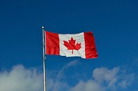 Canadian flag against blue sky. Free public domain CC0 photo.