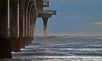 New Brighton Pier. NZThe pier was officially opened on 1 November 1997, on the site of the original New Brighton Pier which had been demolished more than 30 years previously. It is the biggest ocean pier in Australasia. Original public domain image from Flickr