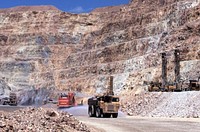 Heavy equipment working in deep pit, July 1991. Original public domain image from Flickr