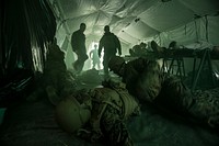 U.S. Navy Corpsmen assigned to Field Medical Training Battalion East (FMTB-E), simulate a mass casualty scenario during a final exercise (FINEX) at Camp Johnson, N.C., March 2, 2016.