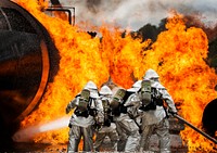 U.S. Air Force reservist assigned to the 919th Special Operations Civil Engineer Squadron firefighters battle a huge blaze during a live-fire training exercise at Hurlburt Field, Fla., March 4, 2016.