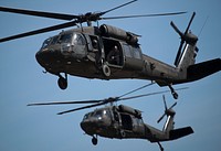 New Jersey Army National Guard Black Hawks return to pick up paratroopers after a successful helicopter-borne parachute jump at Coyle Drop Zone, Joint Base McGuire-Dix-Lakehurst, N.J., March 12, 2016.