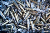 Spent 5.56 mm ammunition casings are collected during small-arms live-fire sustainment training at Joint Base Elmendorf-Richardson, Alaska, Nov. 29, 2017. Original public domain image from Flickr