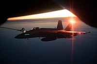 A U.S. Air Force KC-135 Stratotanker assigned to the 340th Expeditionary Air Refueling Squadron, Al Udeid Air Base, Qatar, refuels a Navy F/A-18E/F Super Hornet assigned to the USS Theodore Roosevelt over the skies of Afghanistan Dec. 7, 2017.