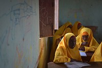 Young Somali girls sit in class at a school in El Baraf, Somalia, on March 5. The town was liberated from the terrorist group Al Shabab by the Burundian contingent of AMISOM on February 23, 2016. AMISOM Photo / Tobin Jones. Original public domain image from Flickr