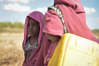 A young girl stands next to her mother in Mahaday, Somalia, on March 3. Mahaday is currently under the control of the Burundian contingent of the African Union Mission in Somalia, as well as the Somali National Army.AMISOM Photo / Tobin Jones.