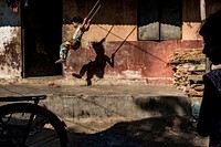 Musahar kid playing on swing, Sauraha, Chitwan District, Nepal, November 2017.